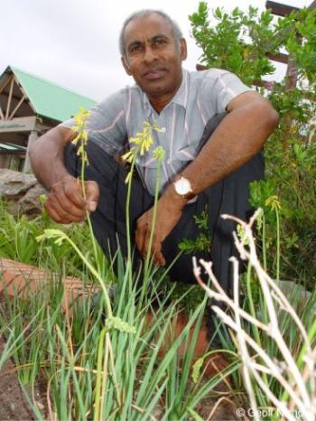 Himansu Baijnath with Kniphofia pauciflora in Durban Botanic Gardens